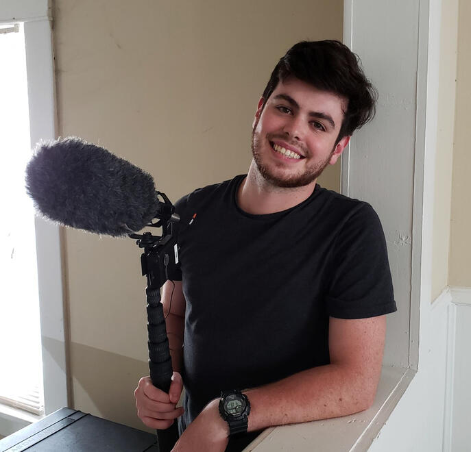 Boom operator pose after a long day of shooting a scene for &quot;Start-Up&quot; Photo by James Luce, 2018.