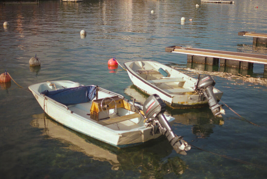 Two boats in a dock near Salt Kettle Road in Bermuda. (Shot on Canon AE-1 on Kodak Portra 400 film, April 2025.)